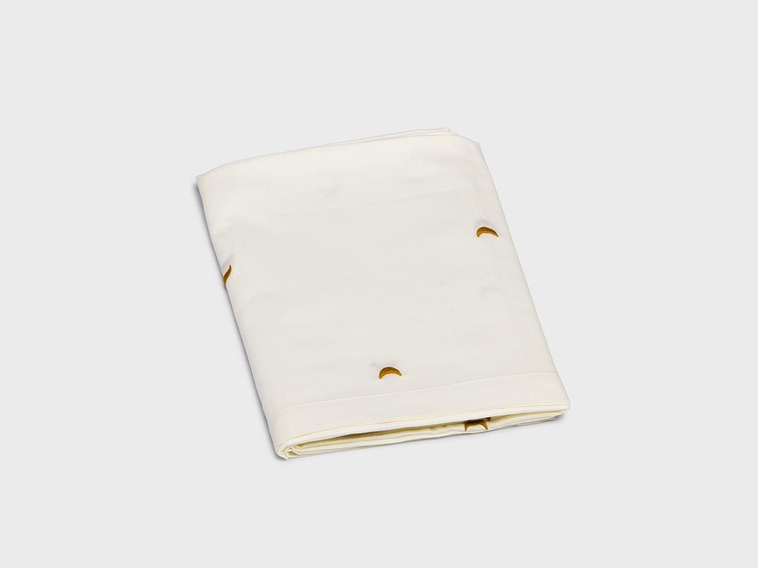 Barnlakan bomullssatin warm white/ochre moon